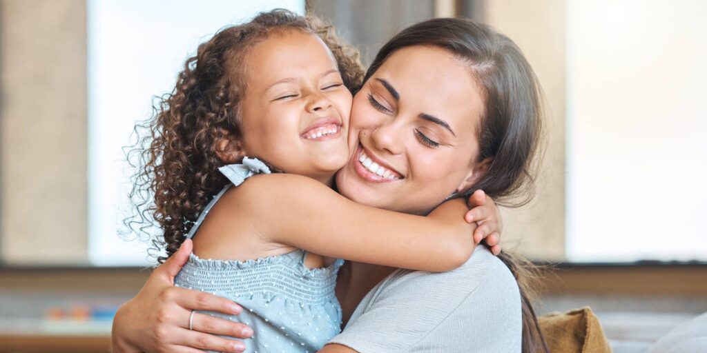 Hug,,Smile,And,Mom,On,Sofa,With,Child,For,Morning