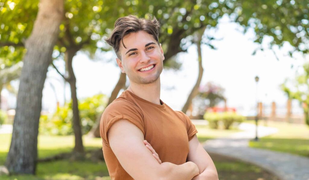 Young,Handsome,Man,With,Arms,Crossed,And,Looking,Forward